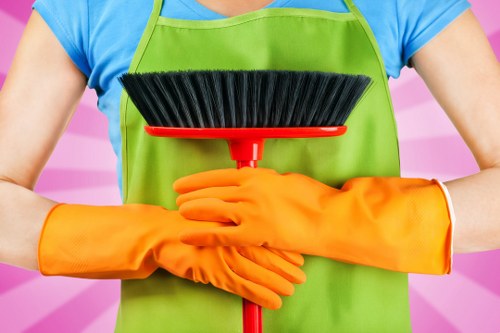 Professional oven cleaner in Brompton deep cleaning a greasy oven