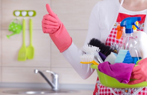 Domestic cleaner in Brompton preparing a tidy living room