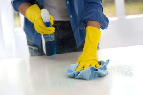 Cleaners removing construction dust after renovation in Brompton home interior